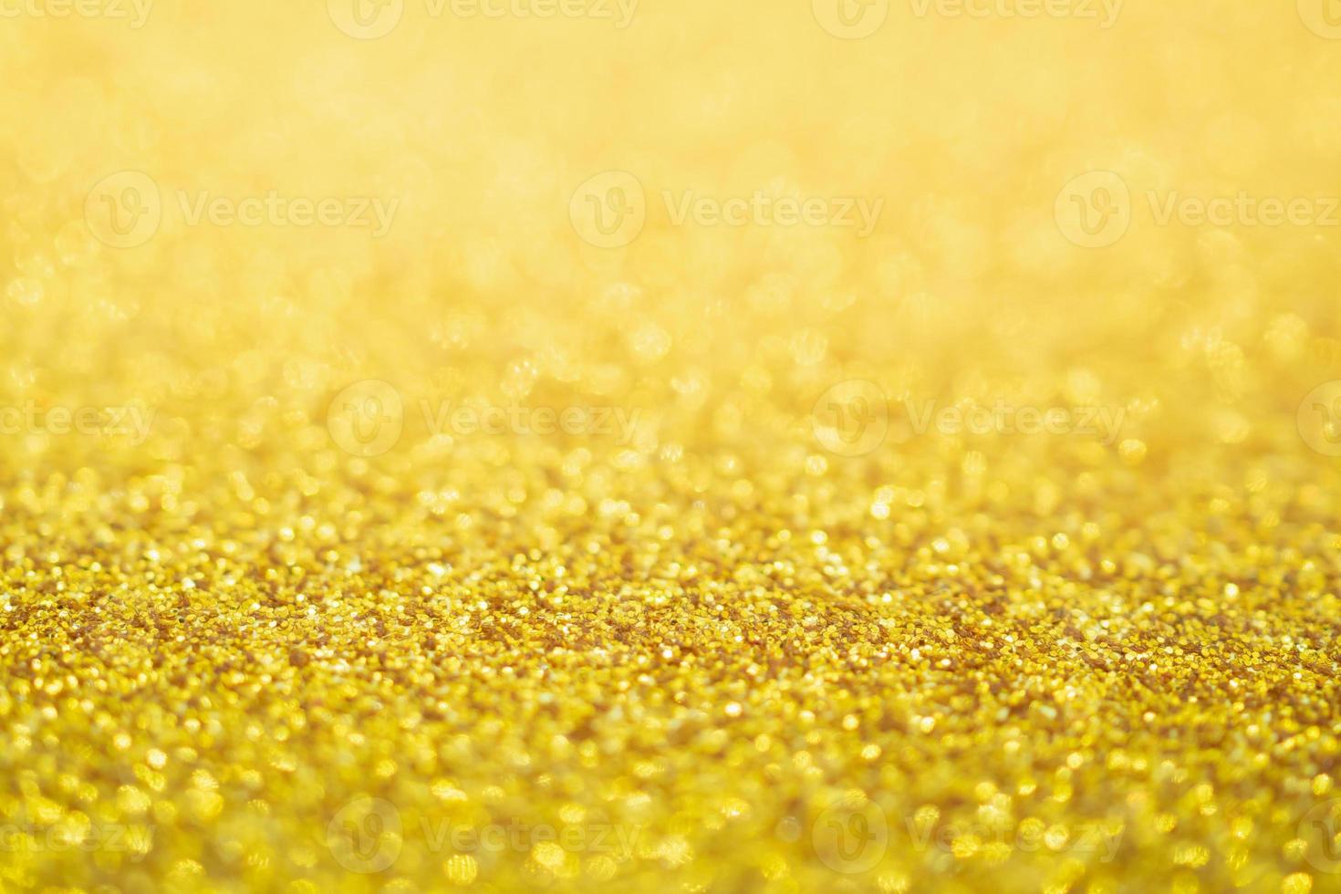 abstracte gouden glitter feestelijke kerst textuur achtergrond vervagen met bokeh licht foto