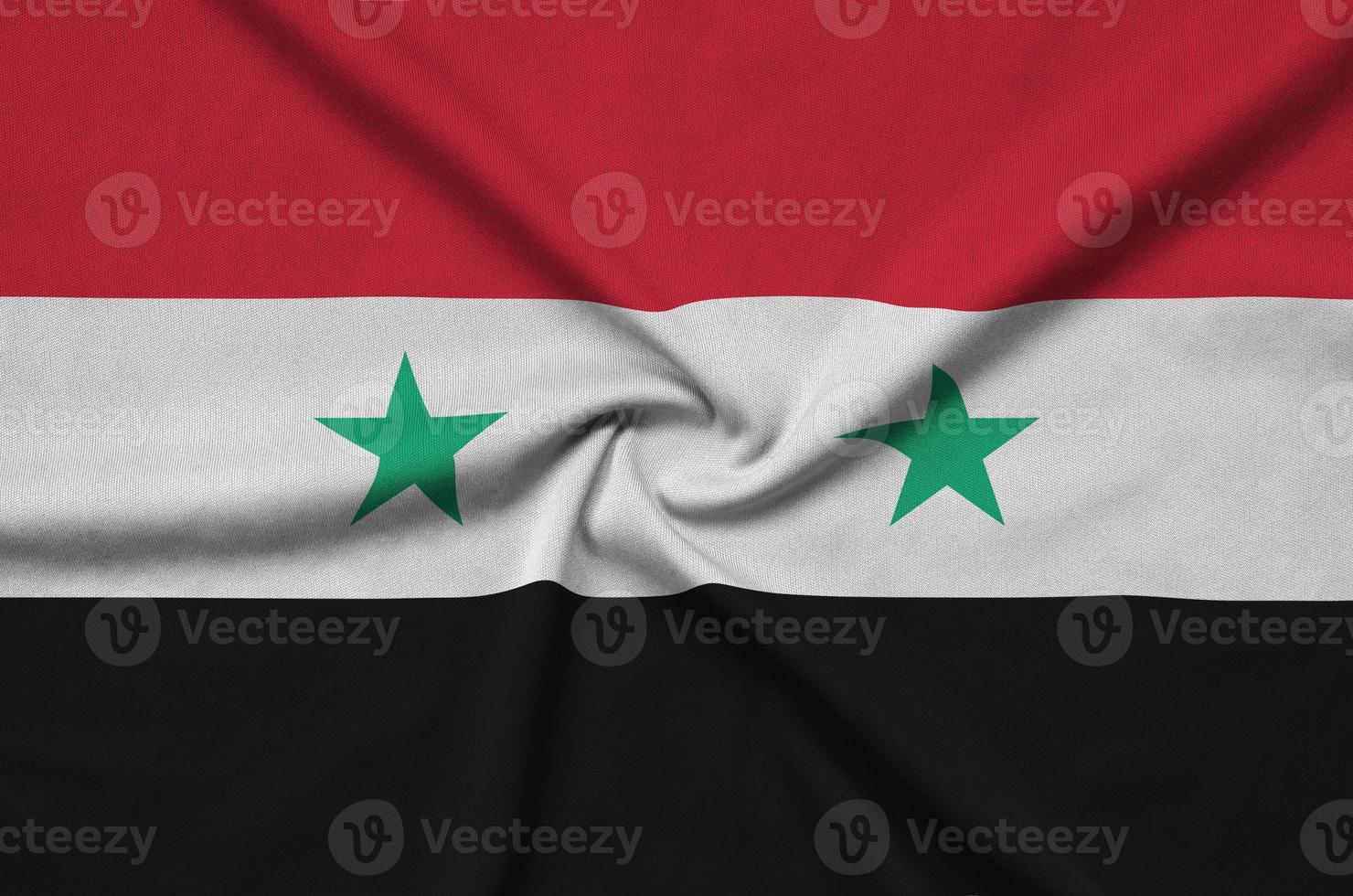 Syrië vlag is afgebeeld Aan een sport- kleding kleding stof met veel vouwen. sport team banier foto