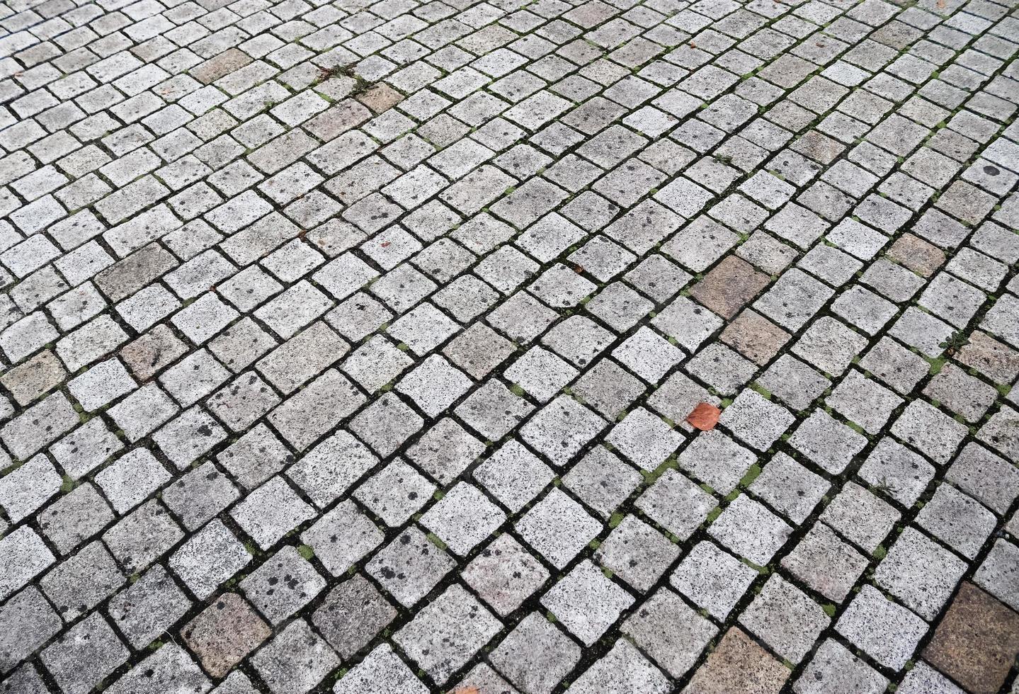 gedetailleerde close-up op oude historische geplaveide wegen en voetpaden foto