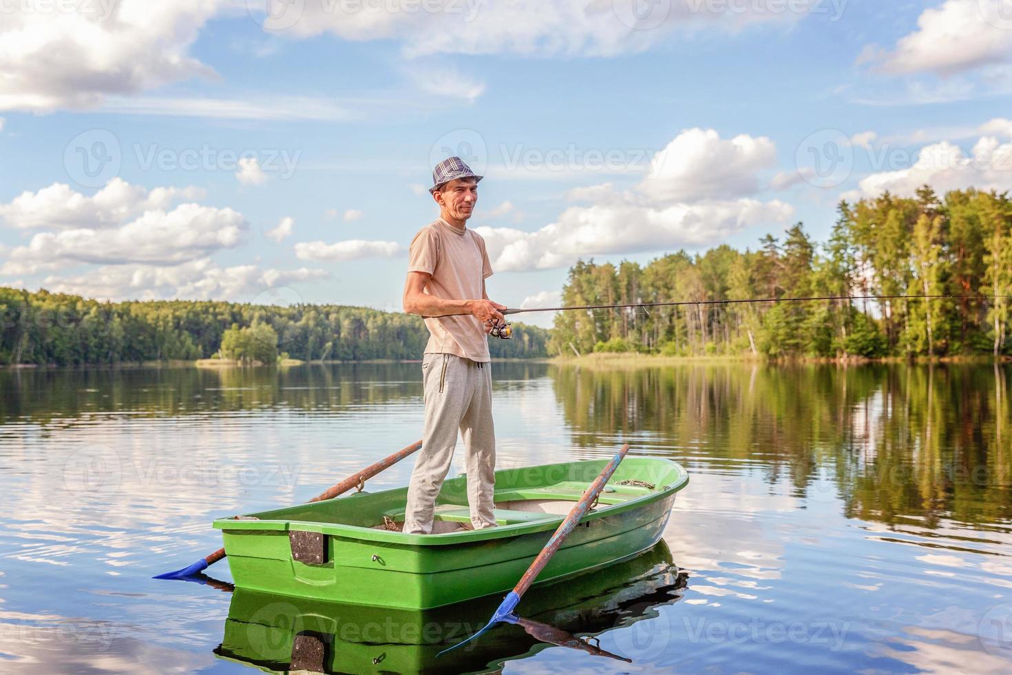 visser in een boot foto