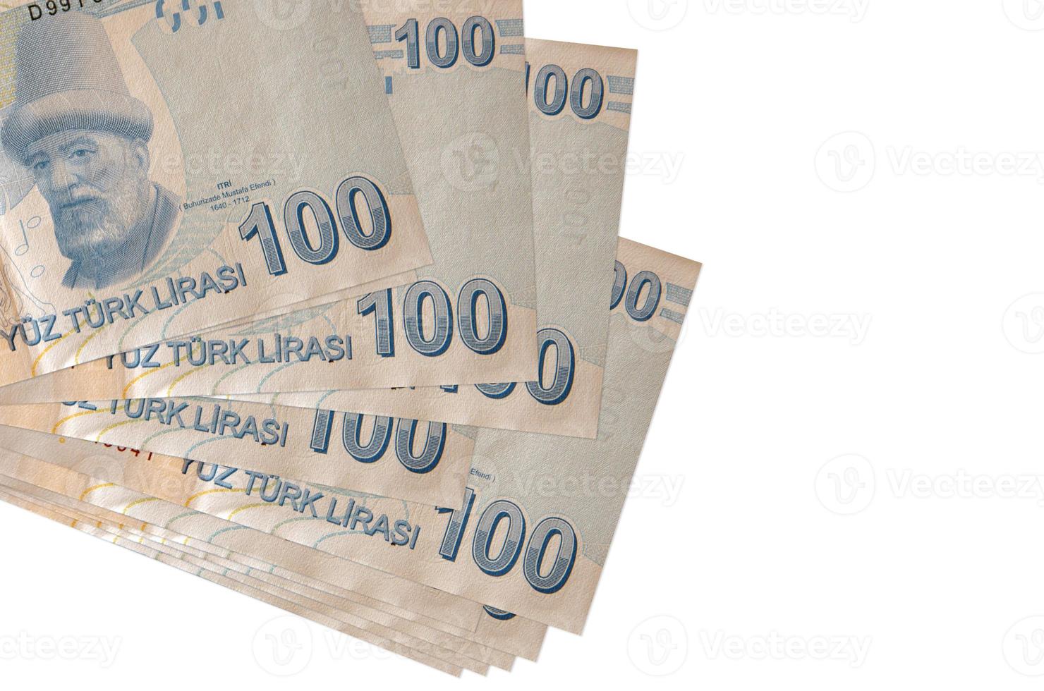 100 Turks lira's rekeningen leugens in klein bundel of pak geïsoleerd Aan wit. mockup met kopiëren ruimte. bedrijf en valuta uitwisseling foto
