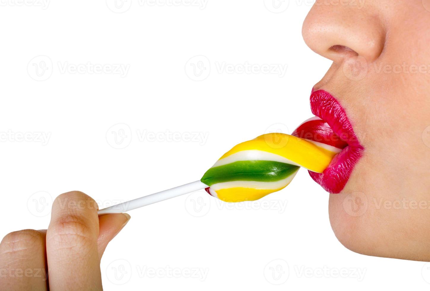 sexy vrouw met rood lippen Holding lolly foto