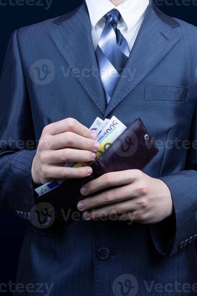 Mens handtas geld foto