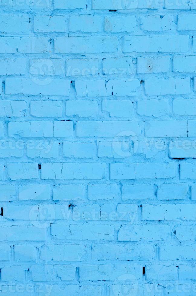 plein steen blok muur achtergrond en textuur. geschilderd in blauw foto