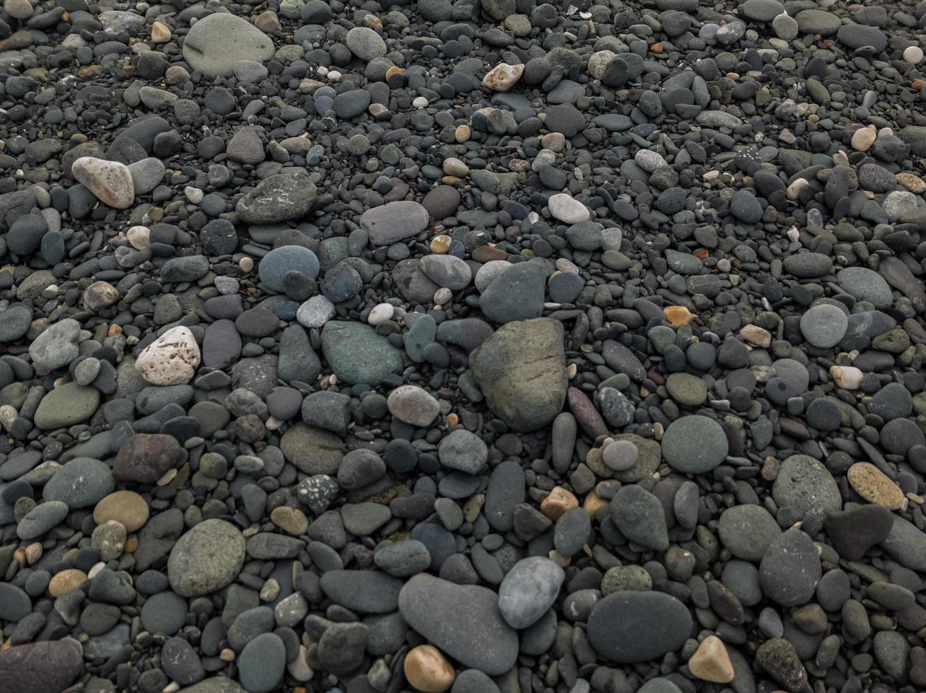 grind achtergrond, uniek kiezelsteen structuur foto