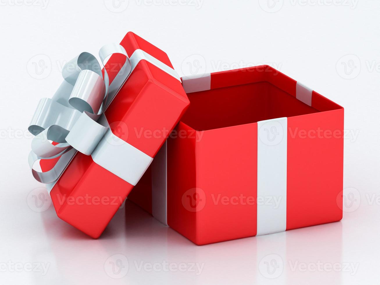 open rode geschenkdozen met wit lint foto