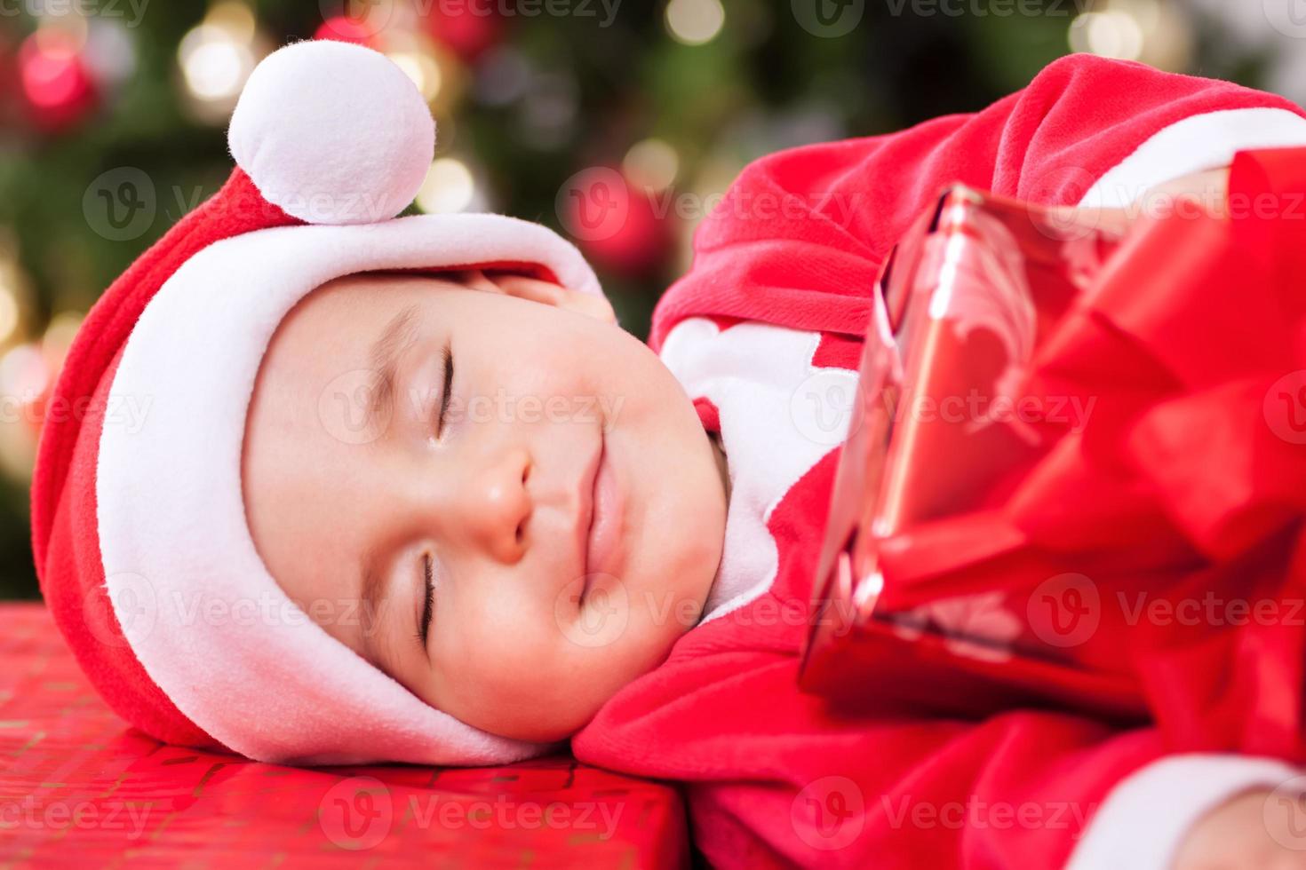 lachende baby kind kerstman met mooie dromen foto