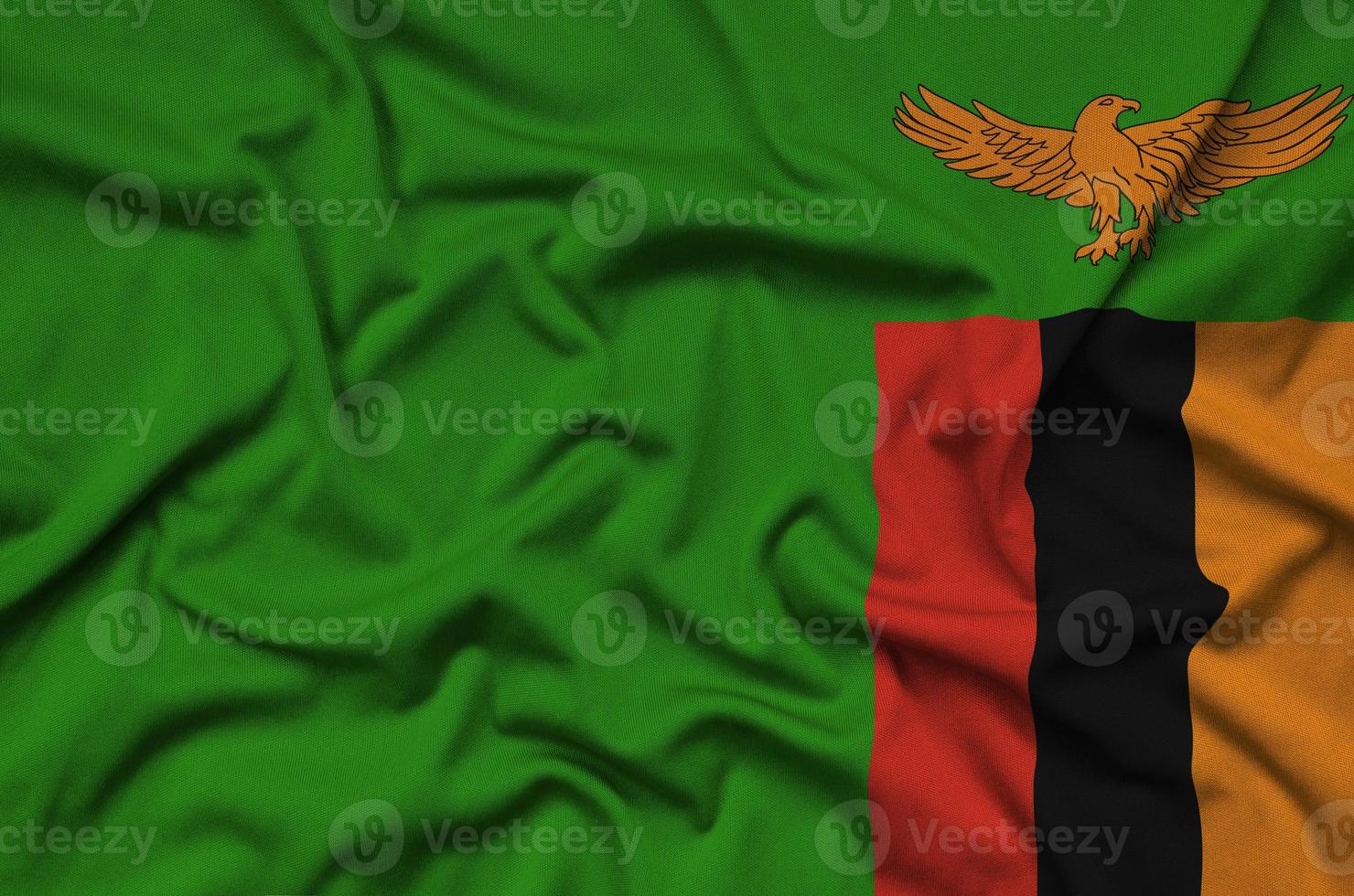 Zambia vlag is afgebeeld Aan een sport- kleding kleding stof met veel vouwen. sport team banier foto