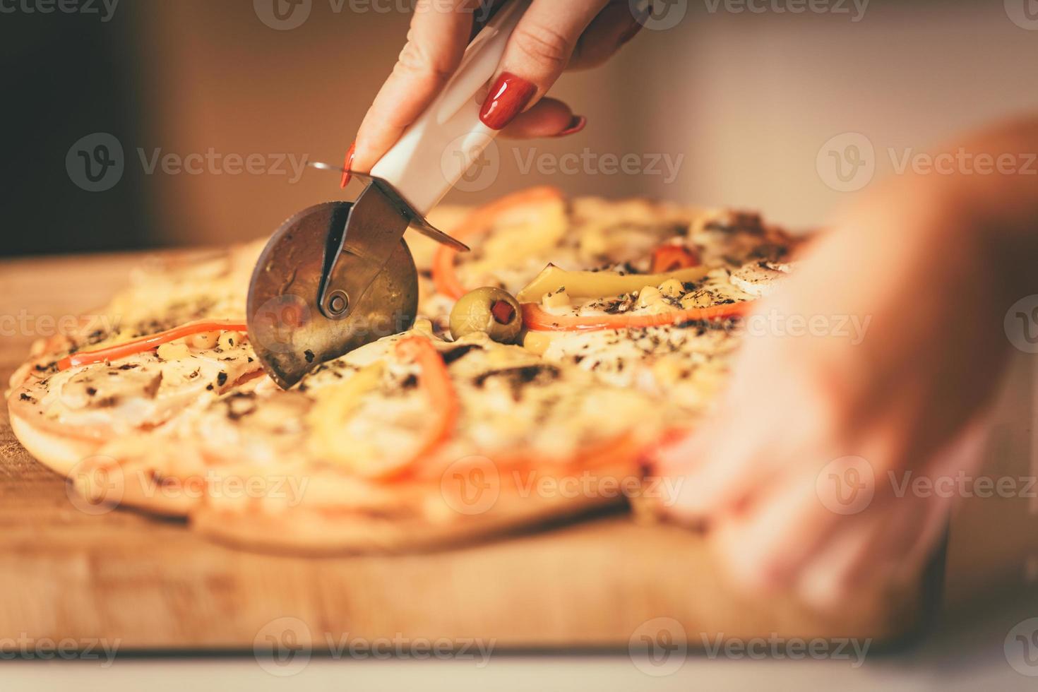 snijdend pizza visie foto