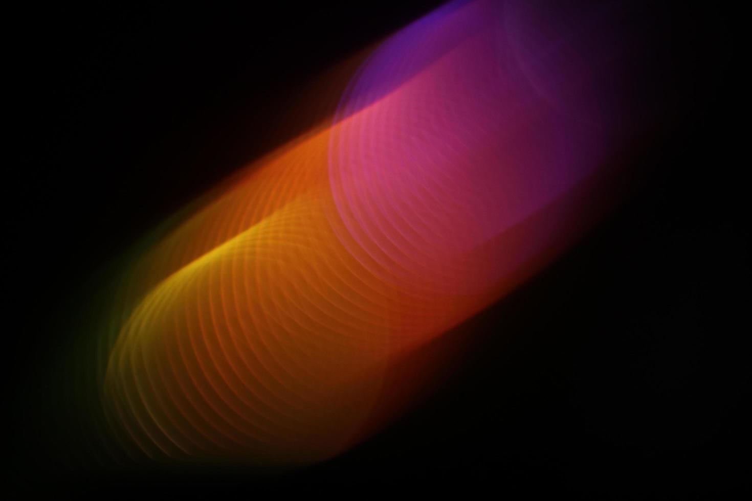 een swoosh van warme kleuren, abstracte lichtfotografie foto