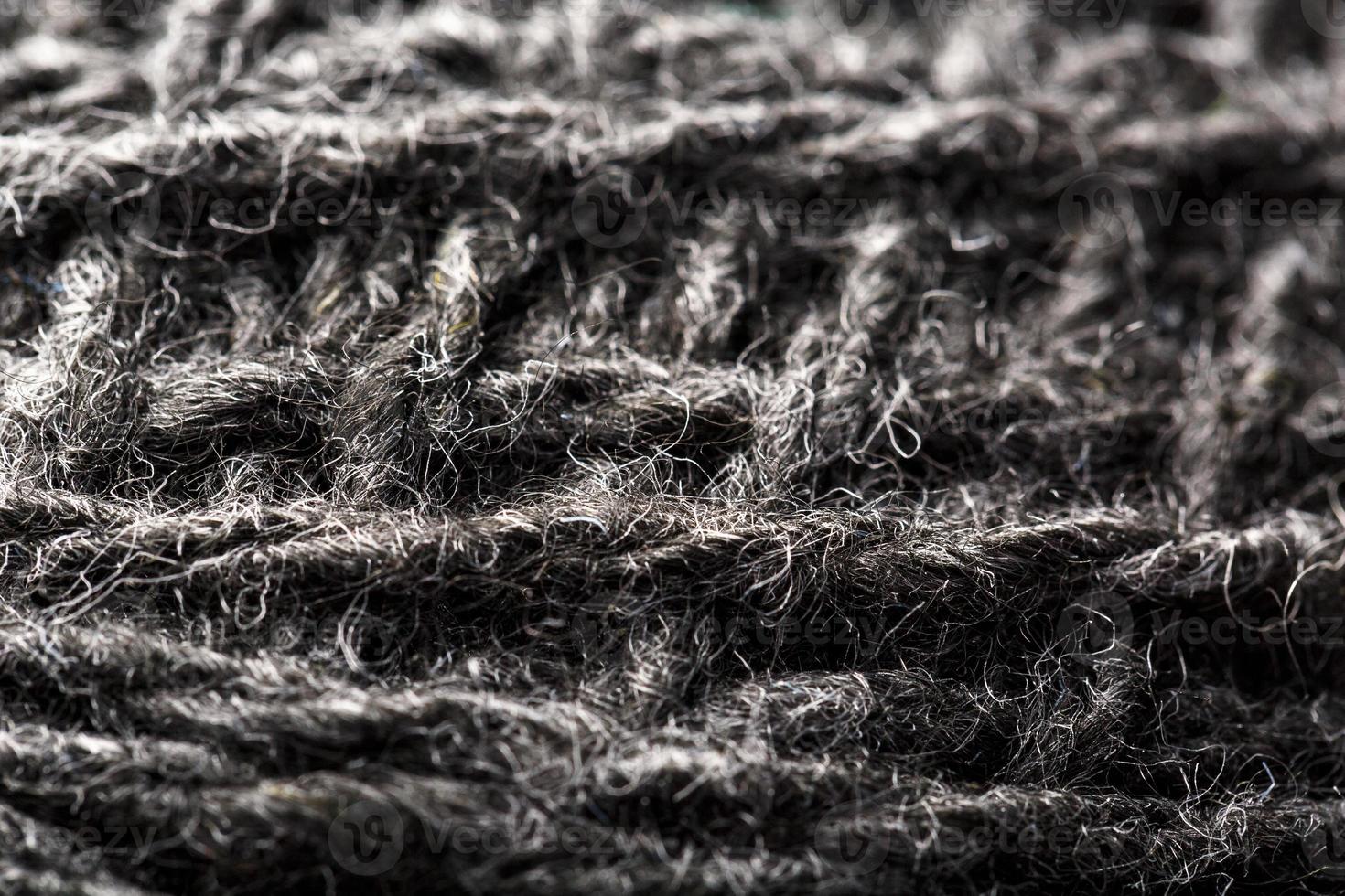 wol garen detailopname grijs draden voor handwerk in macro. achtergrond structuur kleding stof voor breiwerk naald. foto