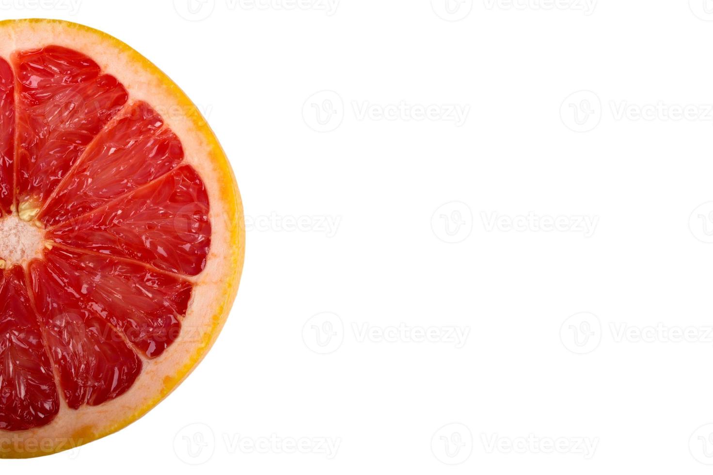 Schijfje grapefruit geïsoleerd op een witte achtergrond foto