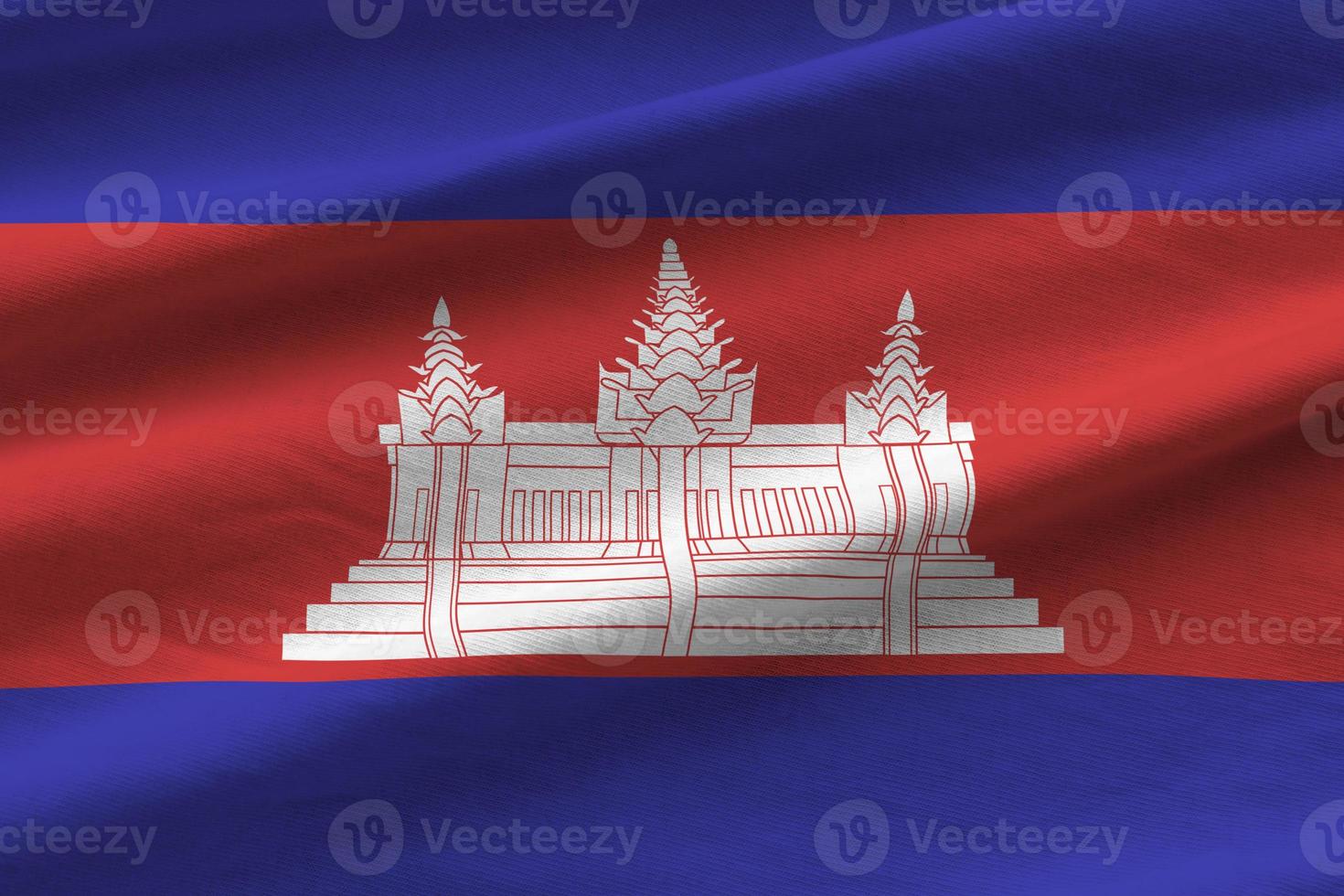 Cambodja vlag met groot vouwen golvend dichtbij omhoog onder de studio licht binnenshuis. de officieel symbolen en kleuren in banier foto