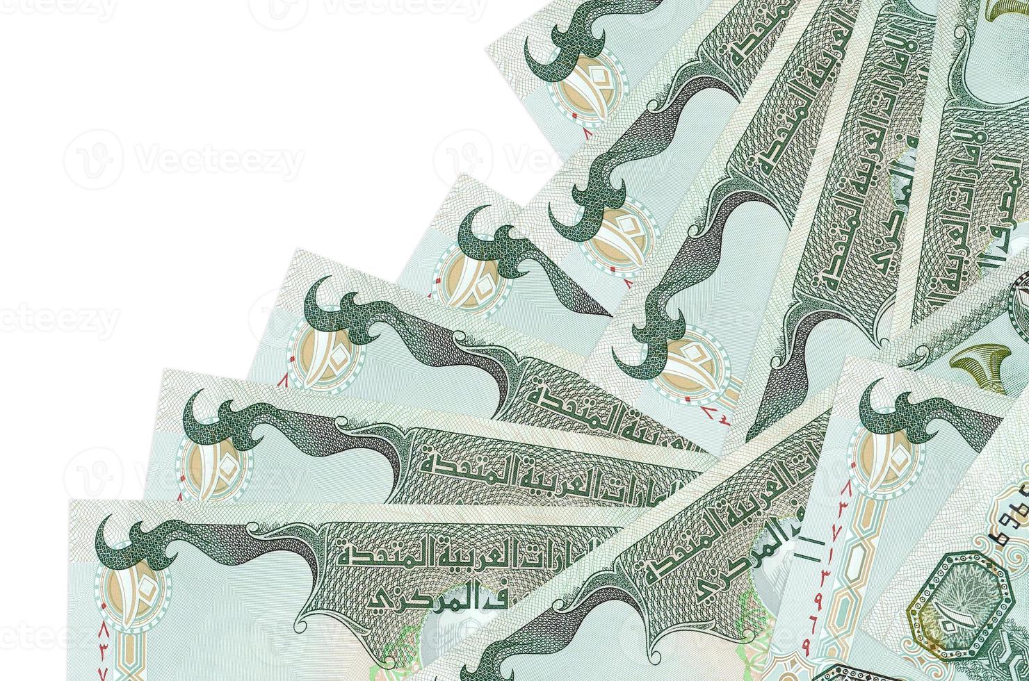 10 uae dirhams rekeningen leugens in verschillend bestellen geïsoleerd Aan wit. lokaal bank of geld maken concept foto