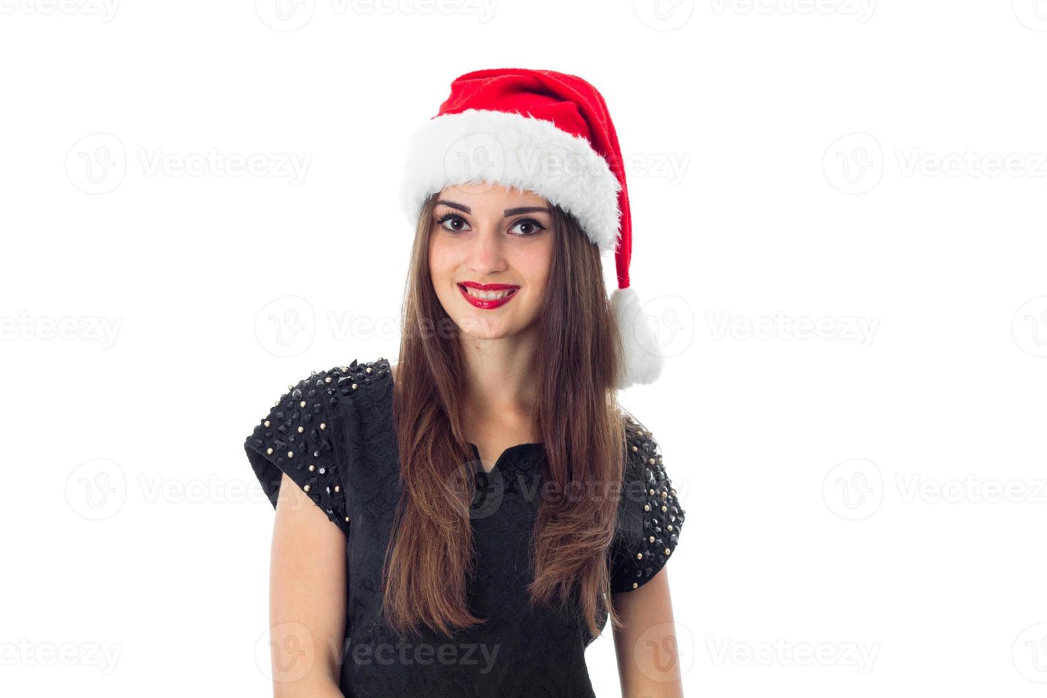 aantrekkelijk brunette meisje in de kerstman hoed foto