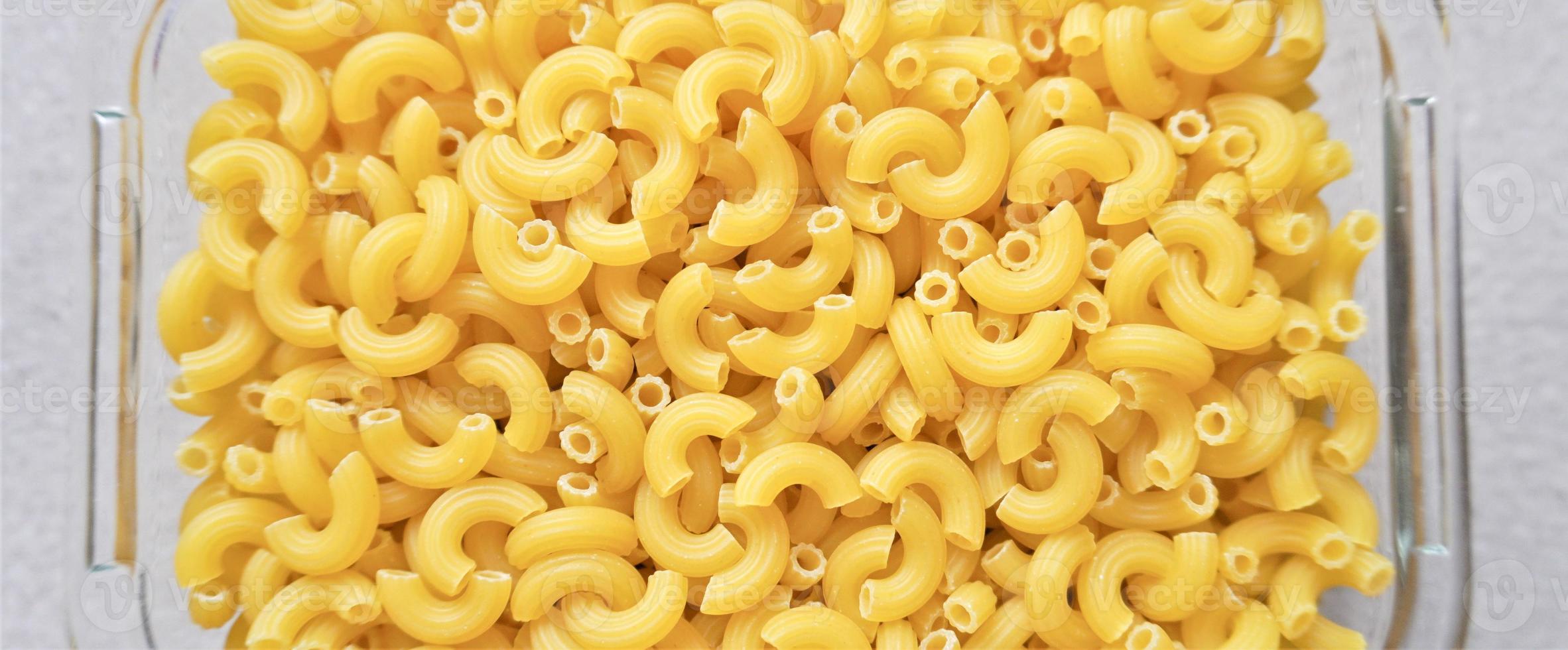 ongekookt elleboog macaroni pasta achtergrond foto