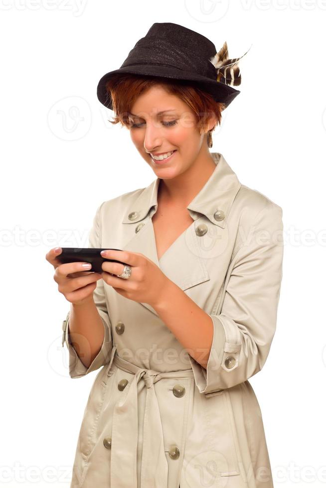 glimlachen jong vrouw Holding slim cel telefoon Aan wit foto