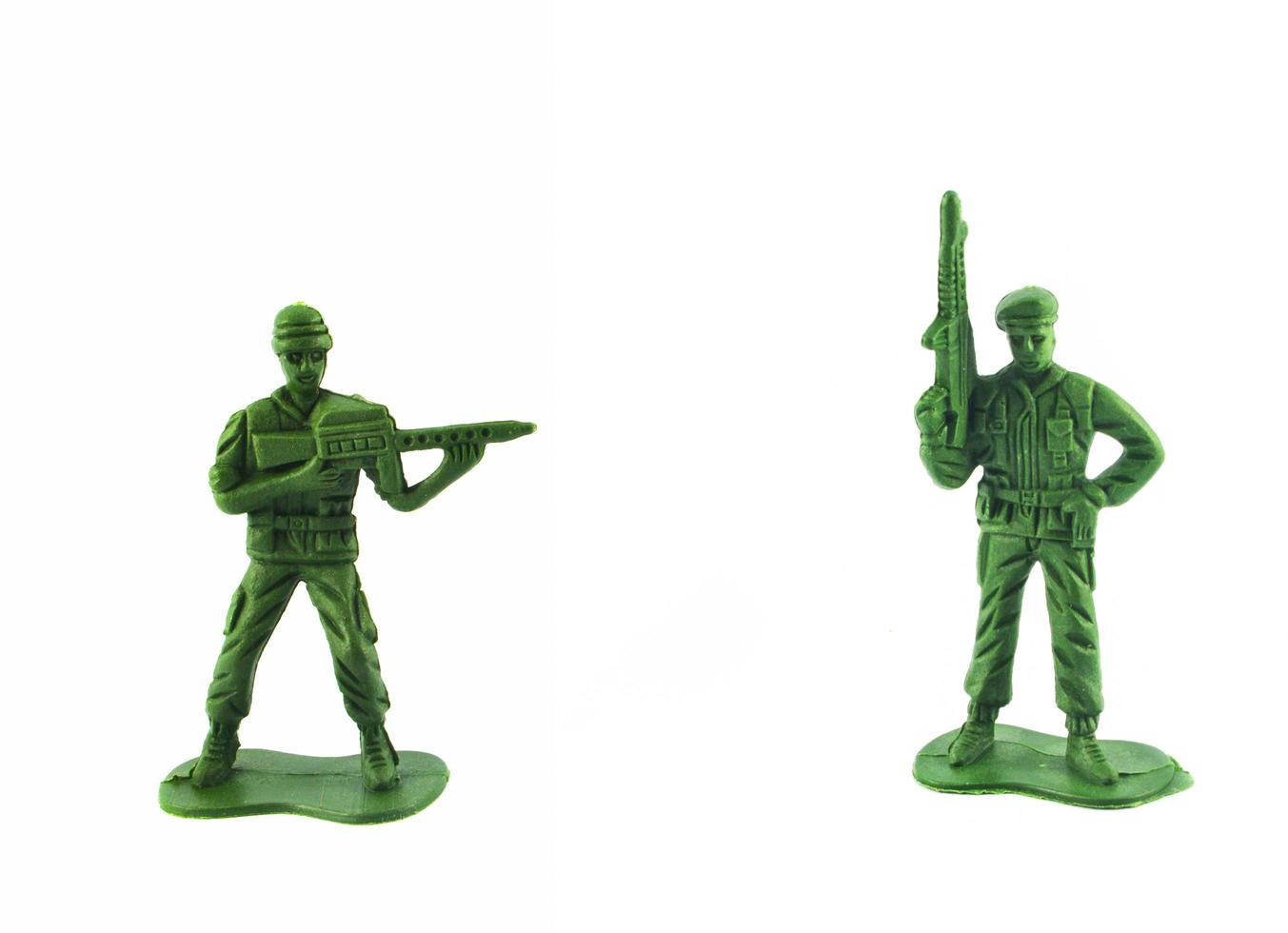 groep van miniatuur houden geweer speelgoed- soldaat geïsoleerd Aan wit achtergrond foto