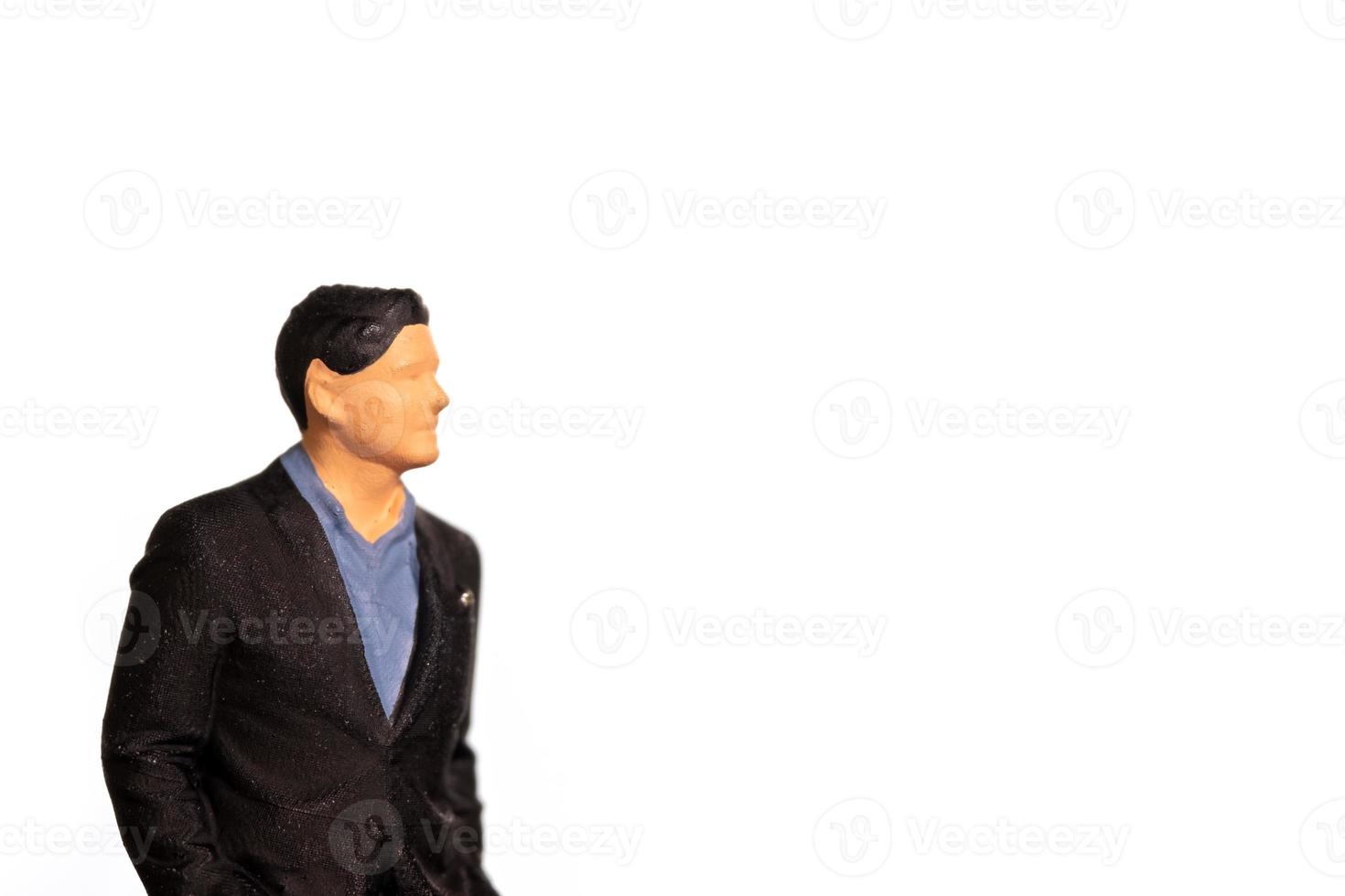miniatuur zakenman Aan wit achtergrond en ruimte voor tekst foto