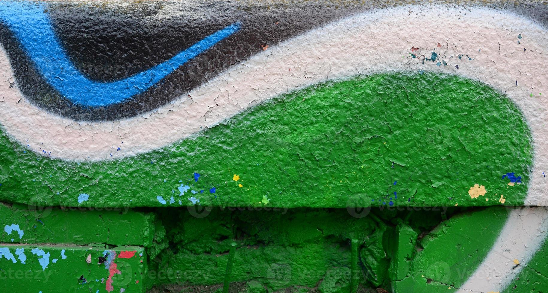 straat kunst. abstract achtergrond beeld van een fragment van een gekleurde graffiti schilderij in khaki groen en oranje tonen foto