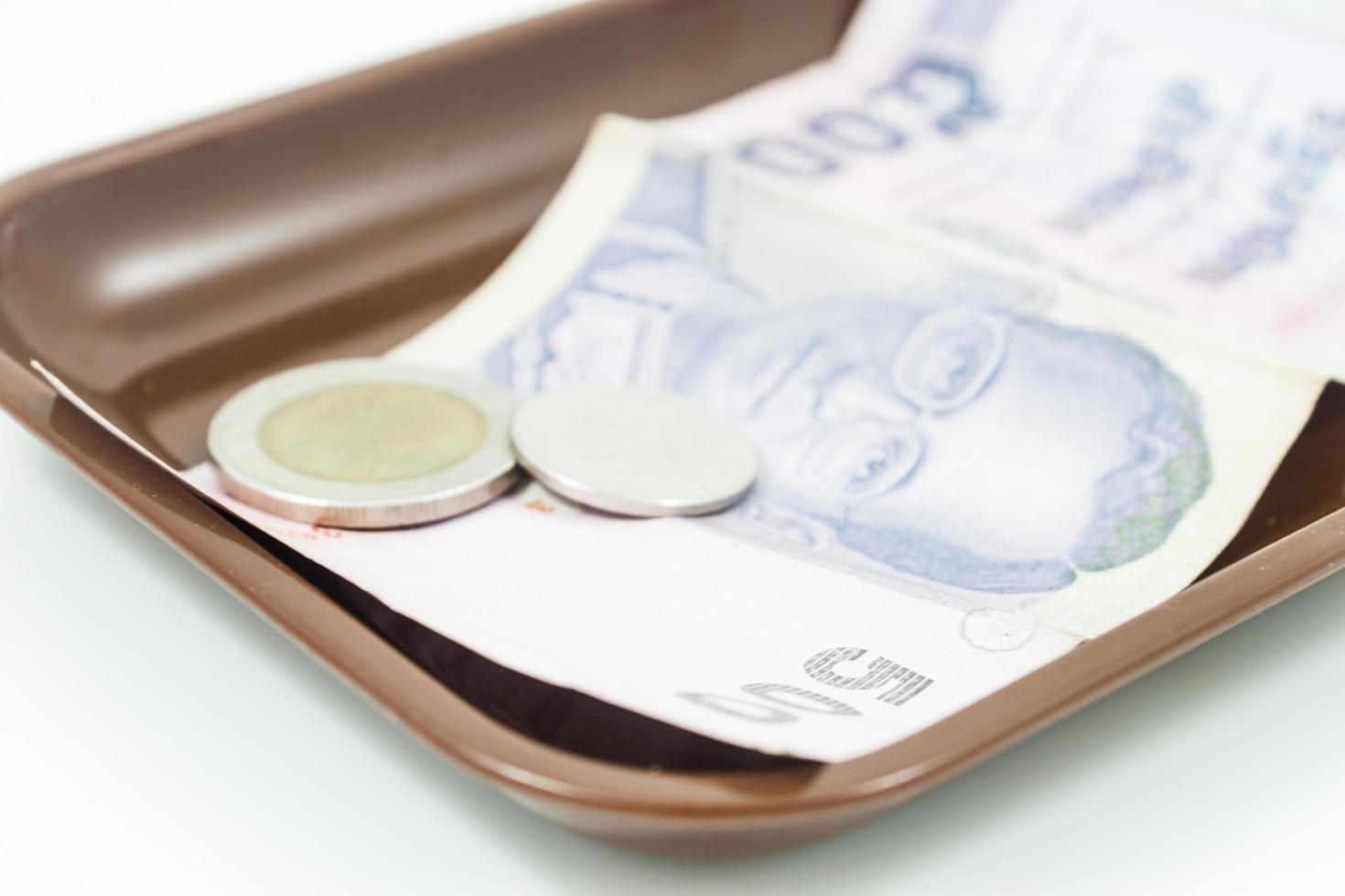 Thaise bankbiljetten en munten in een lade foto