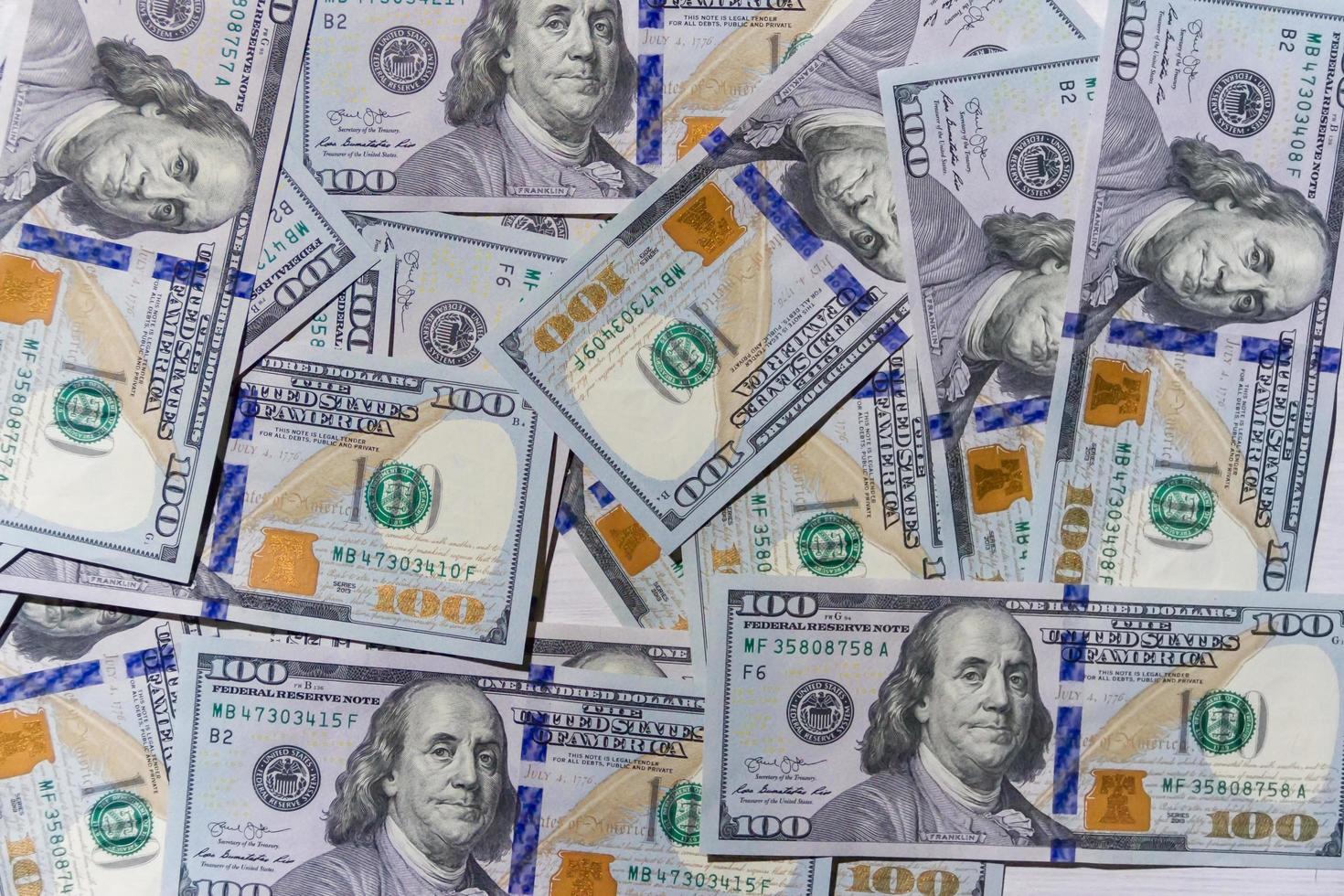 achtergrond structuur rekeningen van 100 Amerikaans dollars foto