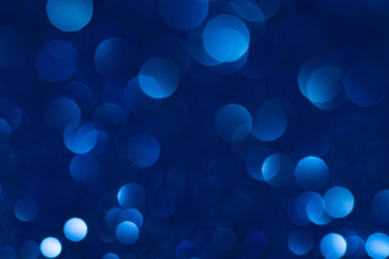 blauw bokeh abstract licht achtergrond. Kerstmis en nieuw jaar concept foto