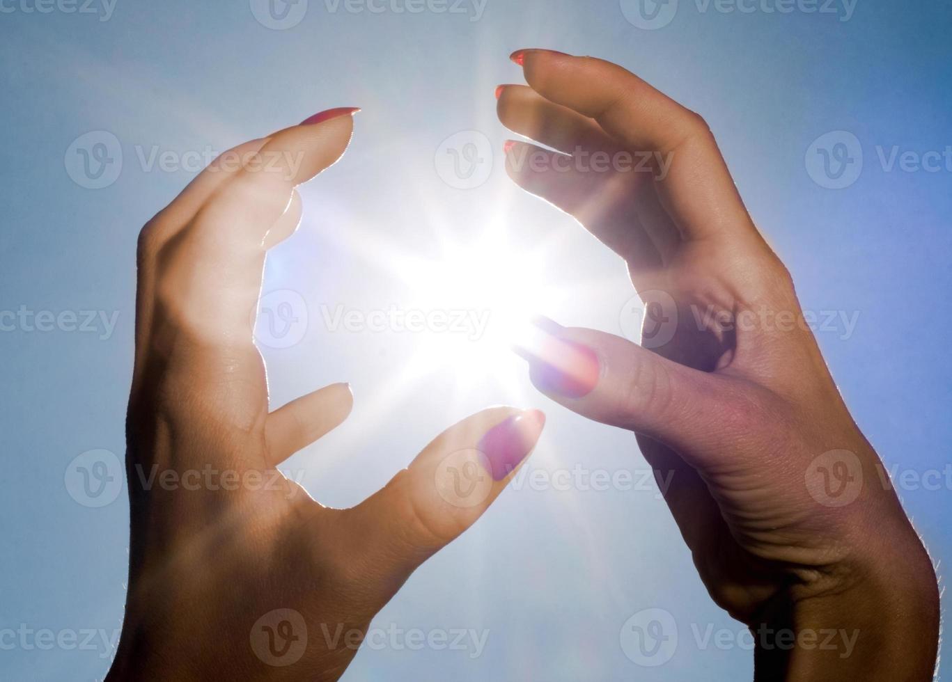 handen en zon foto
