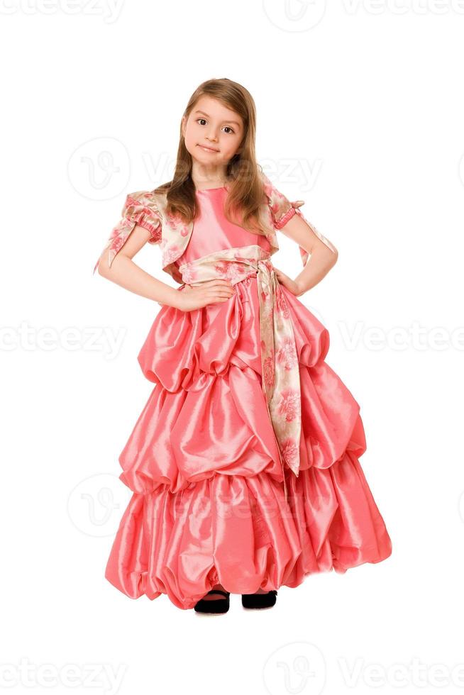 schattig weinig meisje in een lang jurk foto