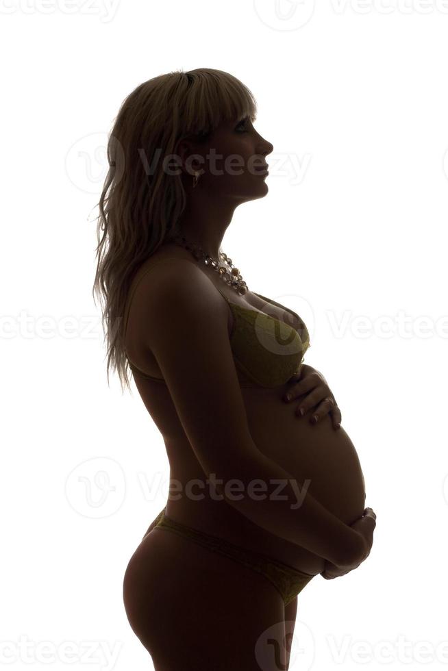 silhouet van een zwanger meisje. geïsoleerd foto