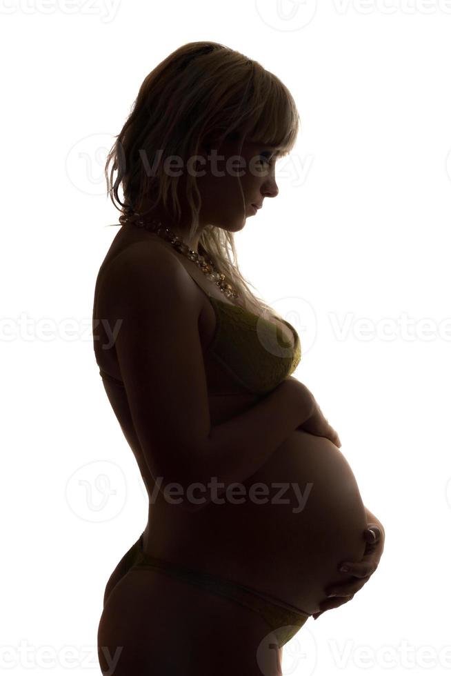 silhouet van een zwanger jong vrouw. geïsoleerd foto