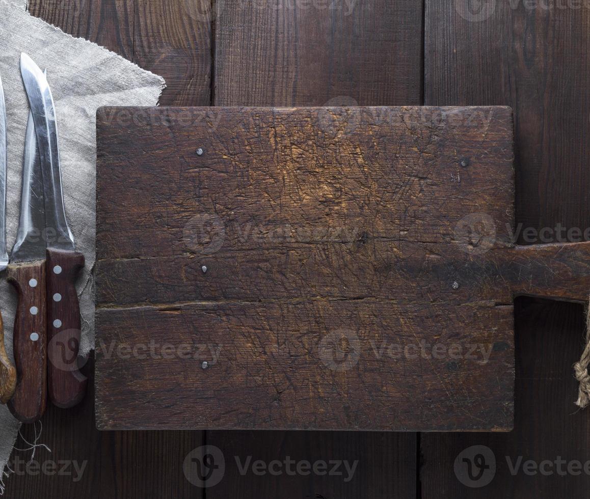 heel oud bruin houten keuken snijdend bord foto