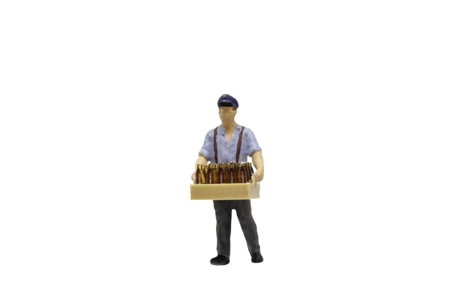 miniatuurbeeldje werknemer geïsoleerd op een witte achtergrond foto
