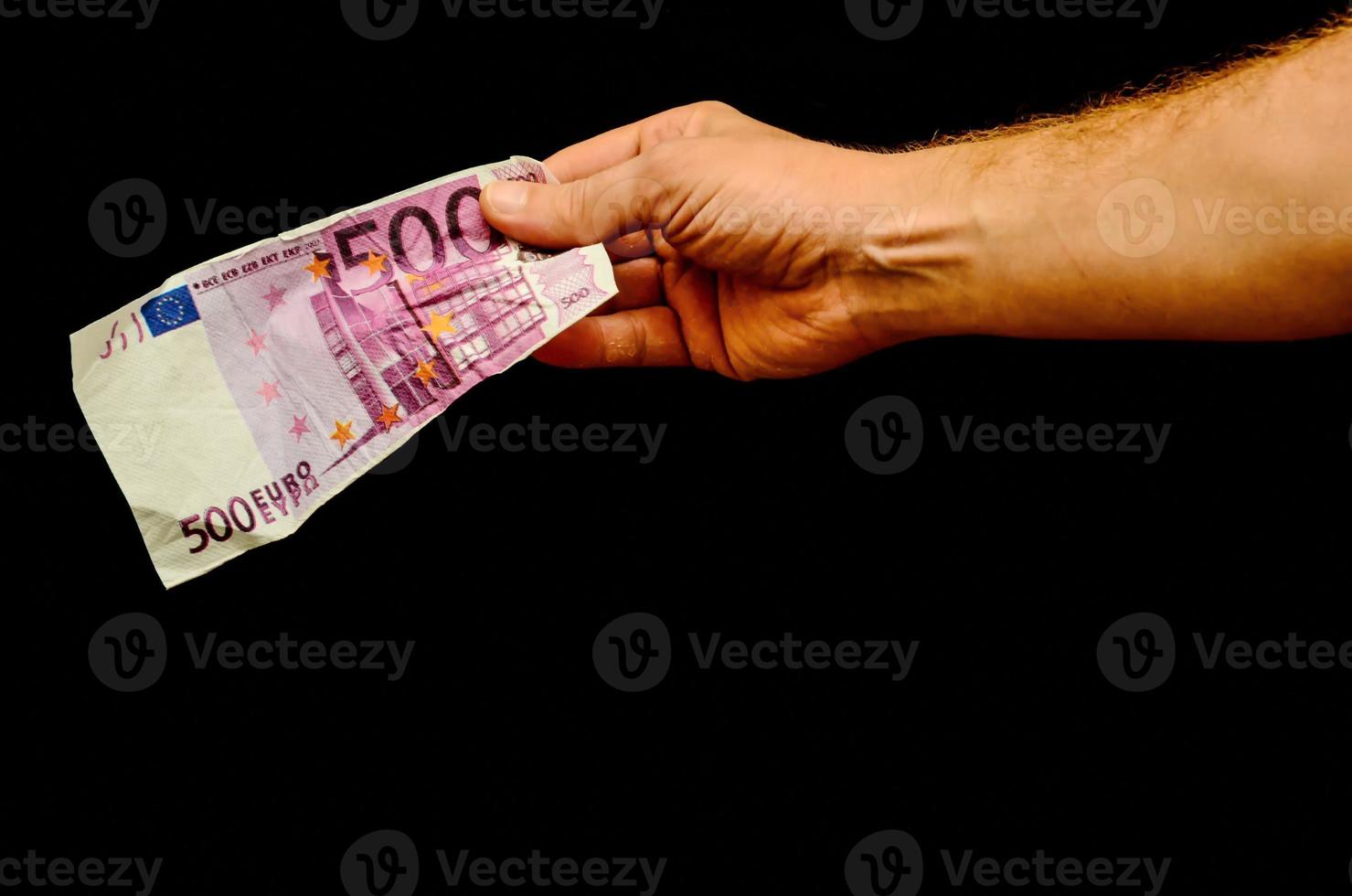 hand- Holding contant geld Bill foto