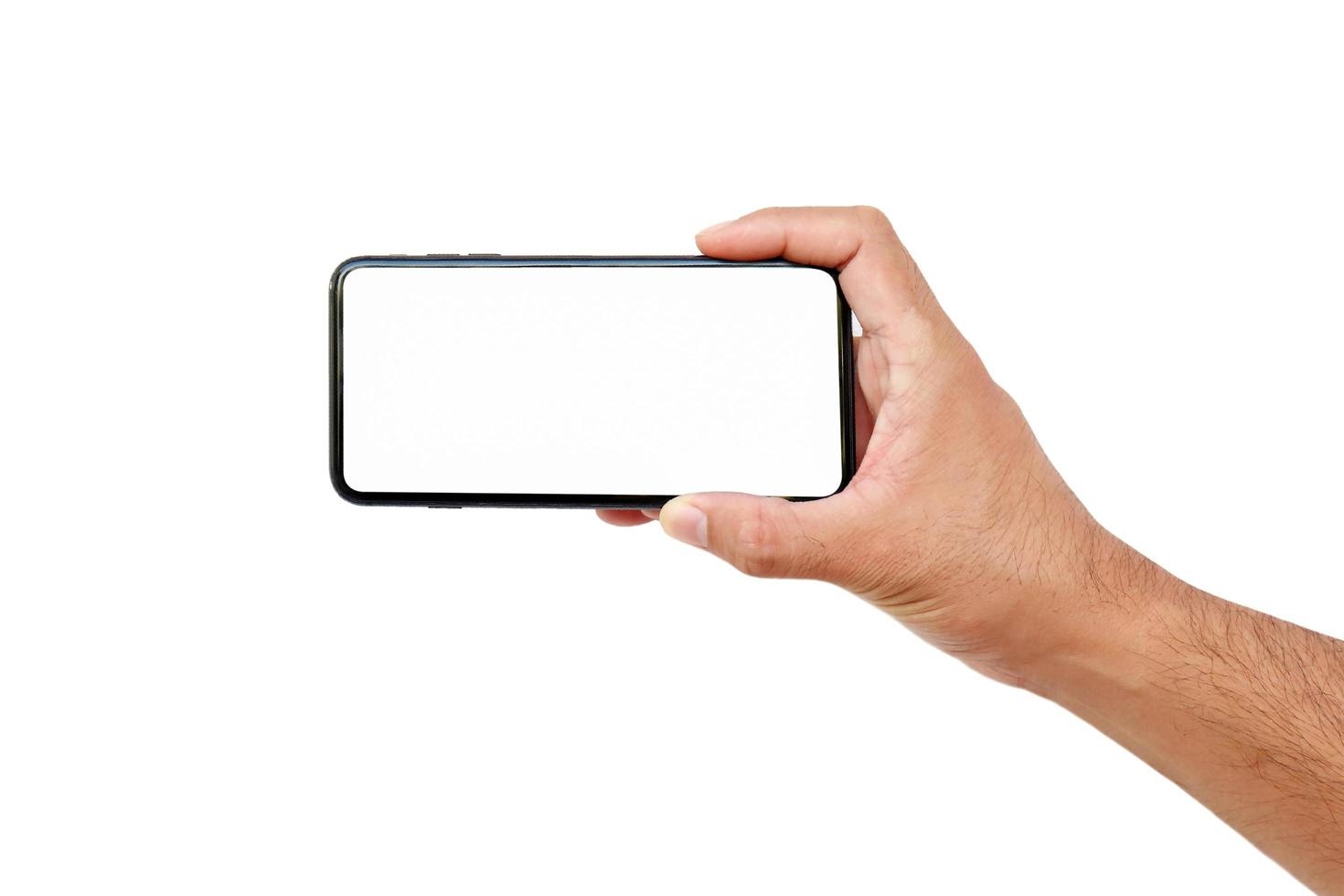 man hand met een wit scherm van de mobiele telefoon geïsoleerd op een witte achtergrond met uitknippad foto