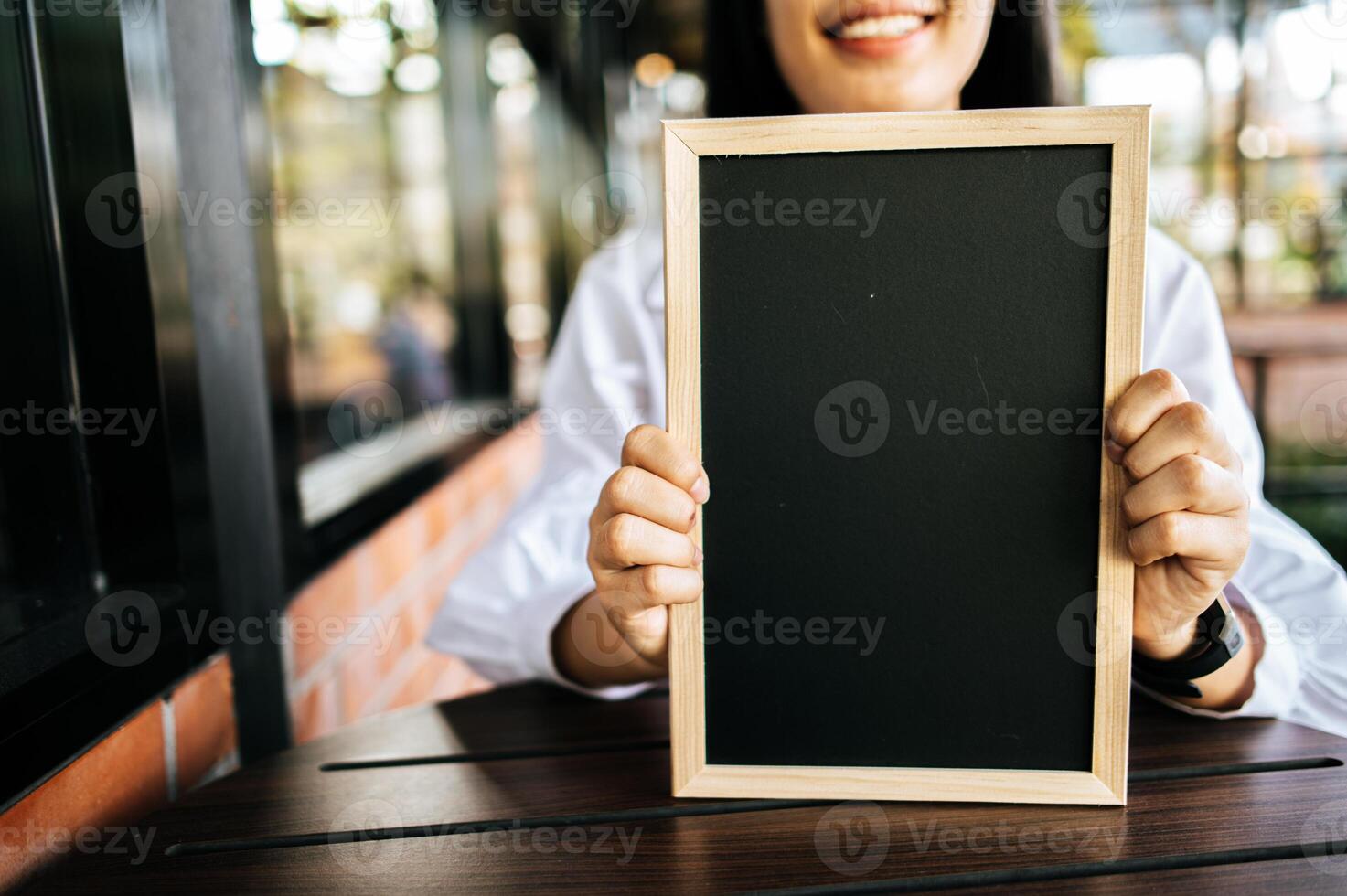 vrouw Holding schoolbord foto