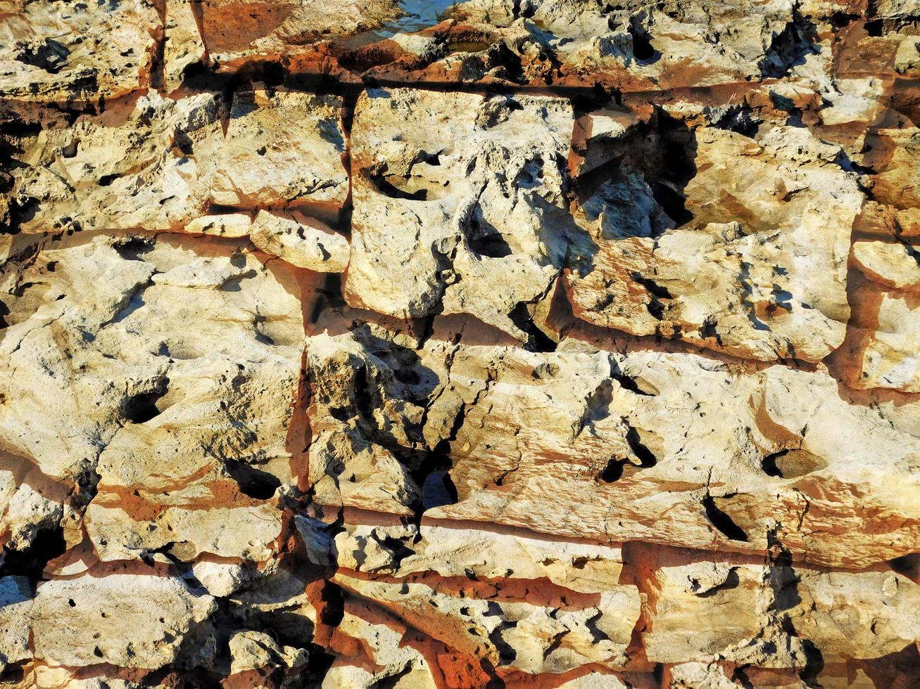 detail van outdoor stenen muur voor achtergrond of textuur foto