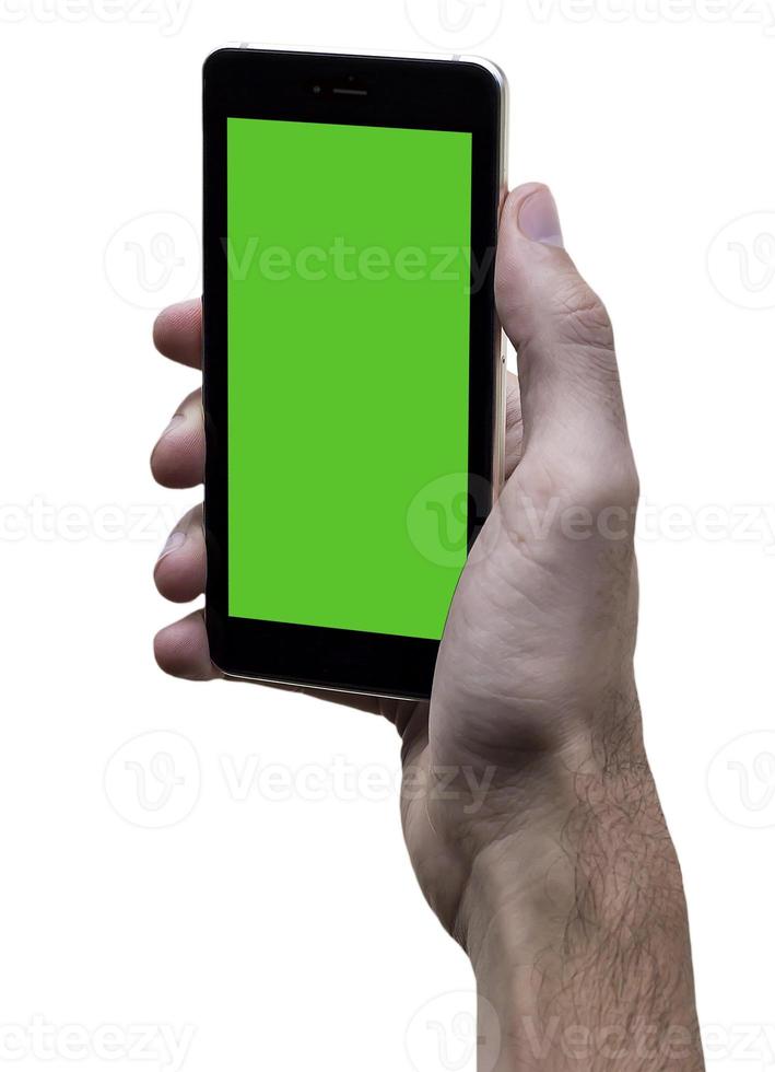 mannetje hand- Holding zwart mobiele telefoon met groen scherm Bij geïsoleerd wit achtergrond. foto