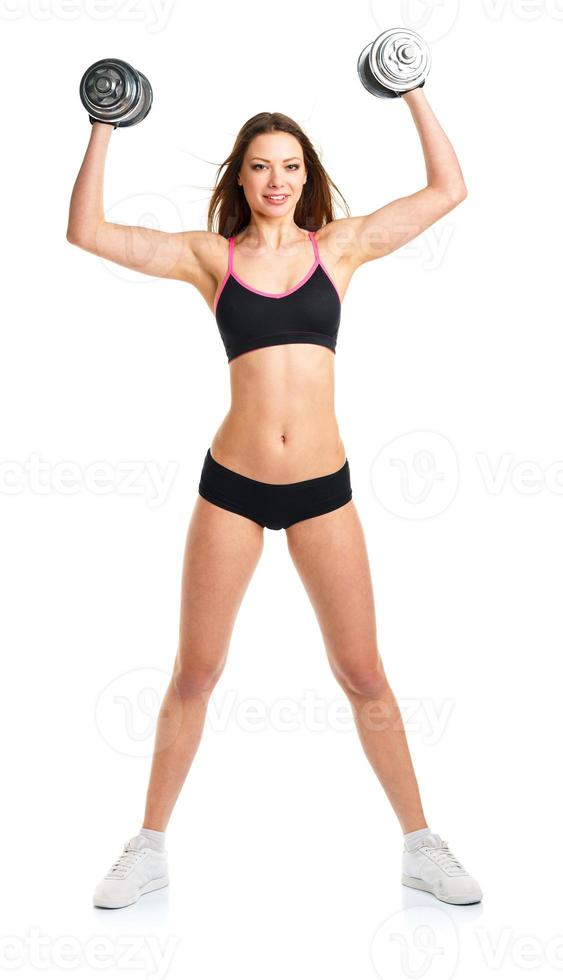 gelukkig atletisch vrouw met halters aan het doen sport oefening, geïsoleerd Aan wit foto