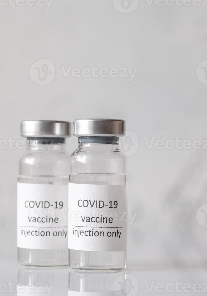 coronavirus vaccin flessen foto