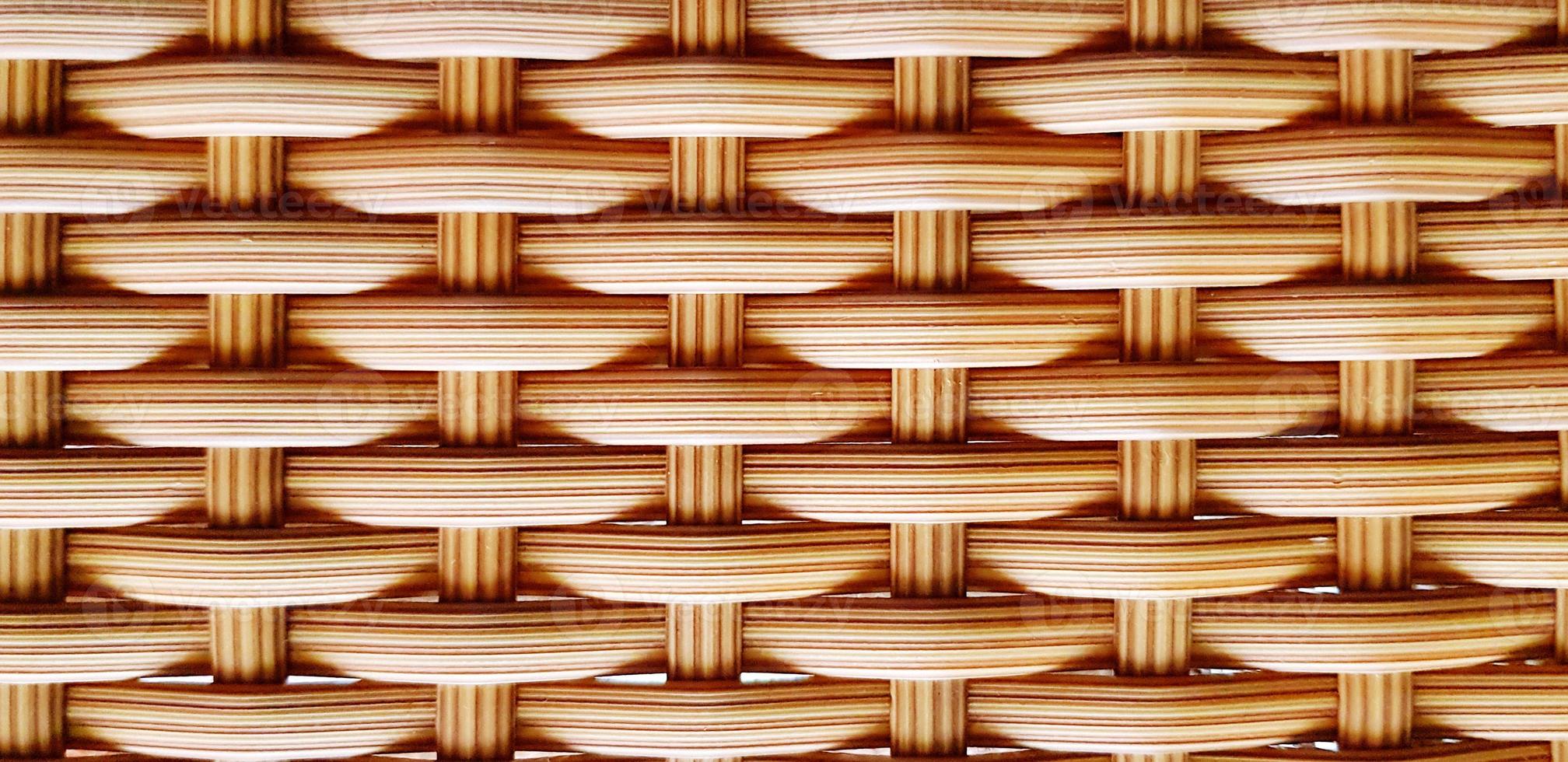 dichtbij omhoog patroon en structuur van bruin weven tafel voor achtergrond. natuurlijk materiaal, oppervlak, kunst behang en naadloos concept foto