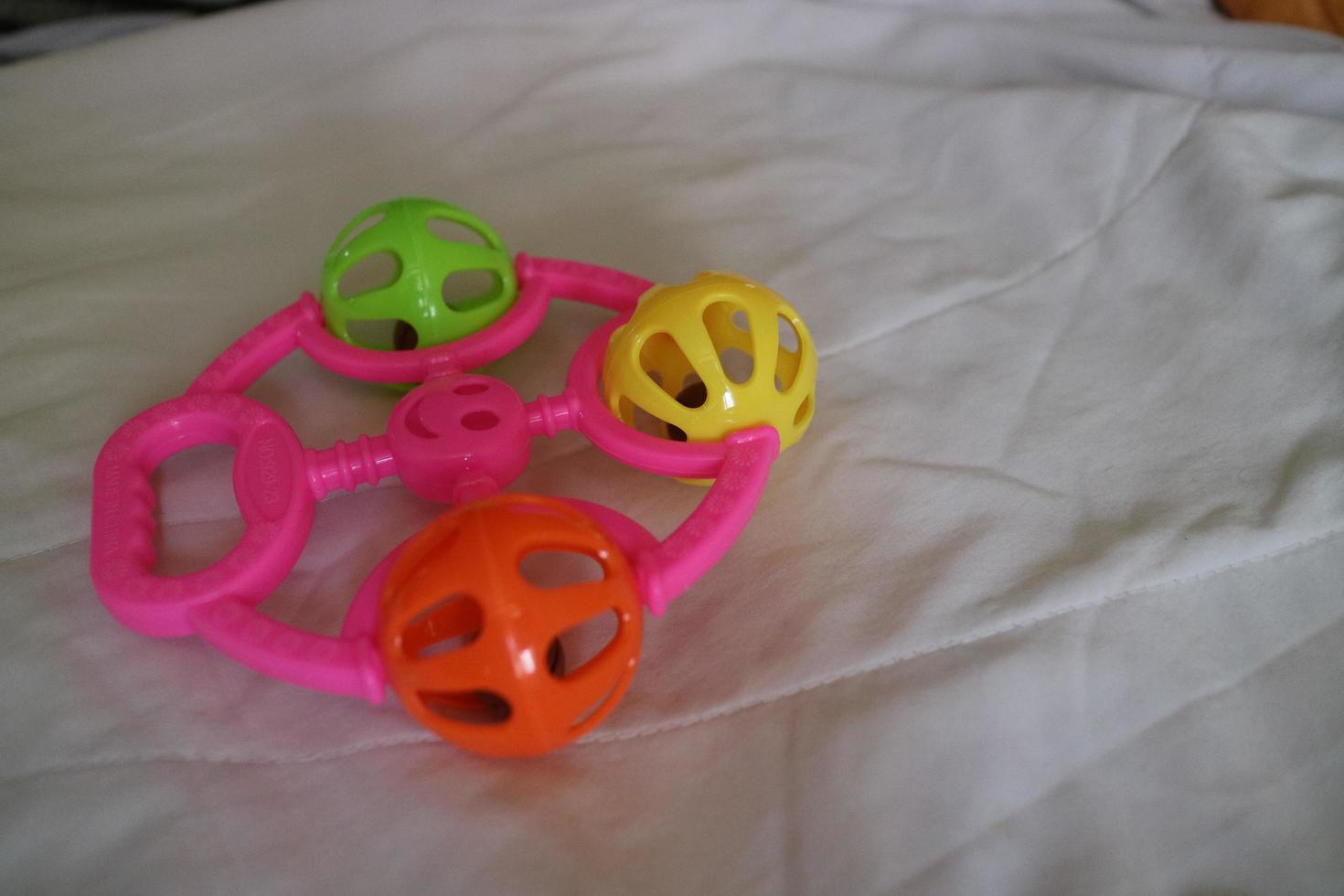 een kleurrijk kleuter speelgoed- dat kan maken een rinkelend geluid met een roze omgaan met foto