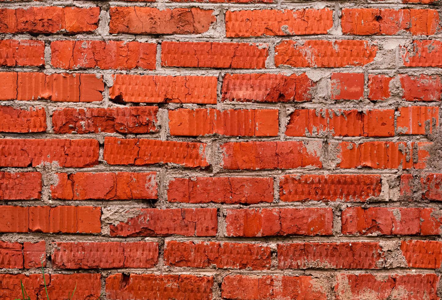 ongelijke rode bakstenen muur achtergrond foto