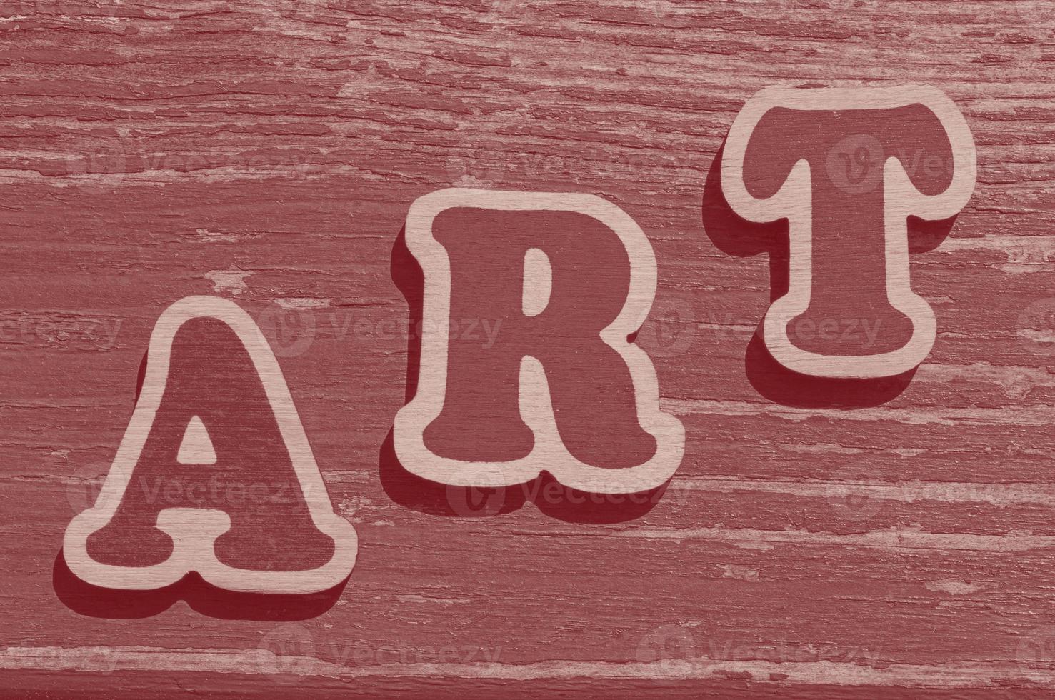 woord kunst gemaakt van houten brieven Aan houten bord foto