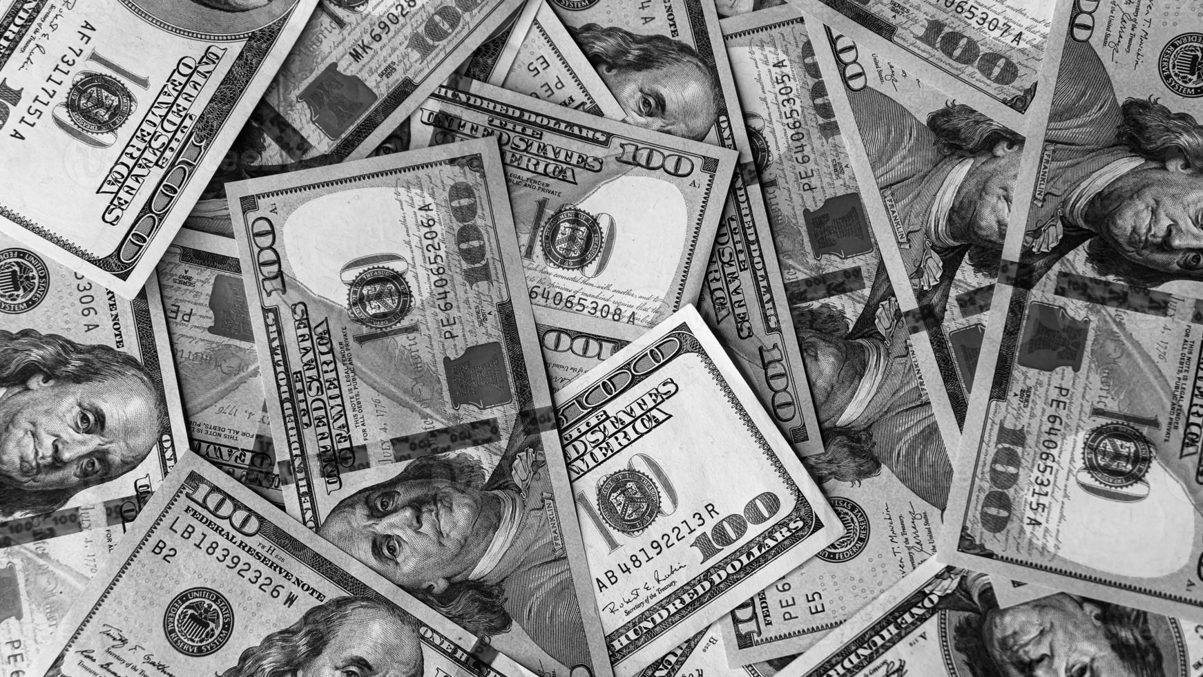zwart en wit achtergrond van ons valuta bankbiljetten financieel concept geld achtergrond honderd dollar rekeningen foto