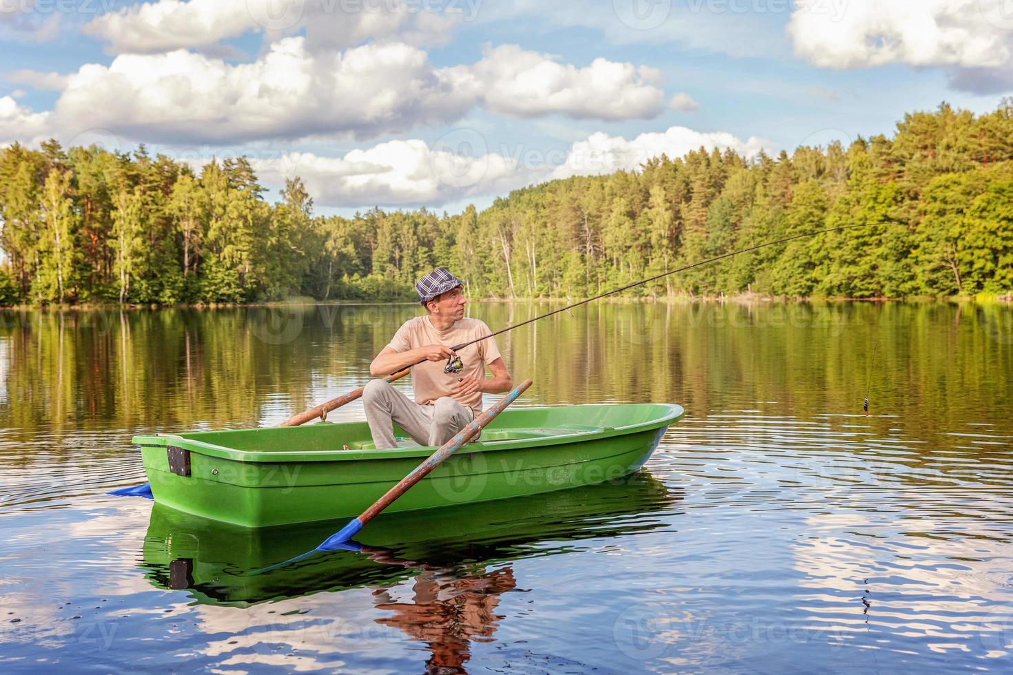 visser in een boot foto