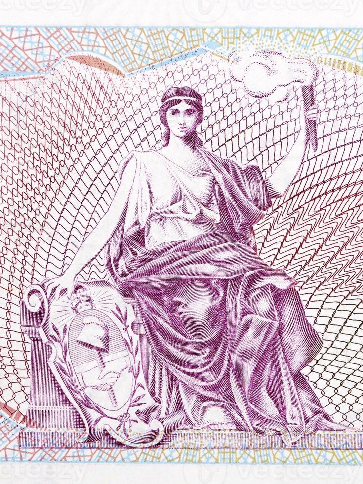 vrijheid allegorie met een kaars van Argentijns geld foto