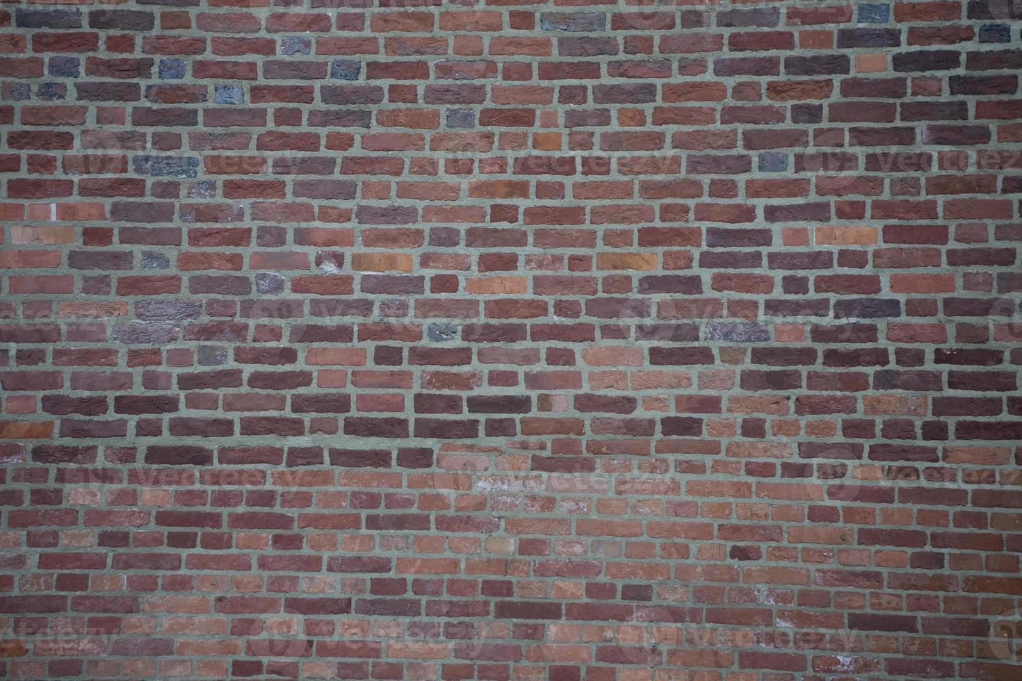 structuur van een muur gemaakt van rood bakstenen met een wit Mortier foto