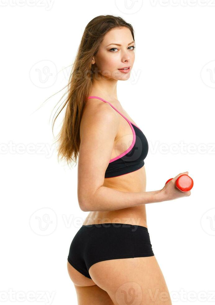 mooi atletisch vrouw met halters aan het doen sport oefening, geïsoleerd Aan wit foto