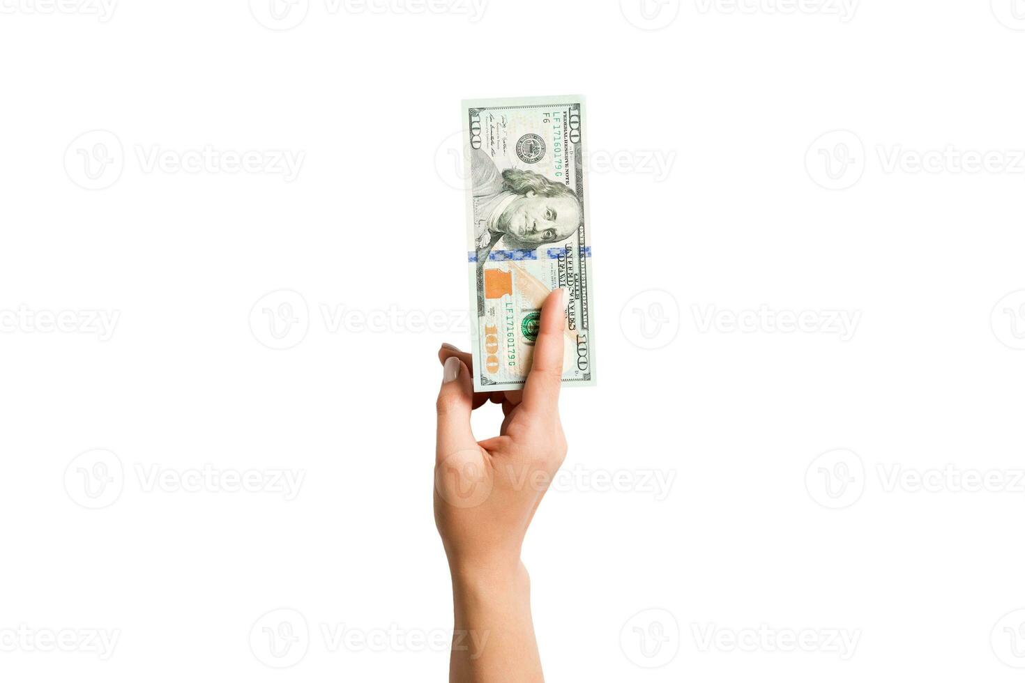 geïsoleerd beeld van vrouw hand- Holding een bundel van dollars Aan wit achtergrond. top visie van betaling concept foto